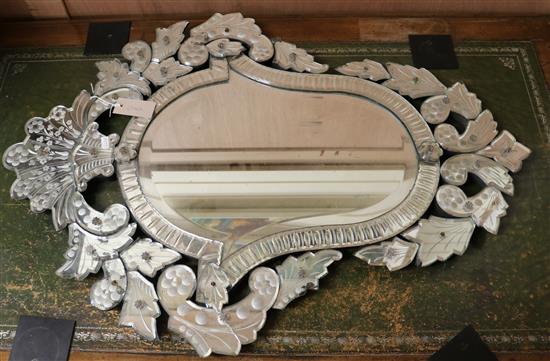 A Venetian style etched wall mirror W.65cm